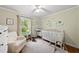 Bright Bedroom with hardwood floors, white furniture, and playful sea-themed decor at 5513 Doemont Dr, Apex, NC 27539
