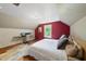 Comfortable bedroom with hardwood flooring, neutral walls, and a cozy bed at 5513 Doemont Dr, Apex, NC 27539
