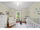 Bright Bedroom with hardwood floors, white furniture, and window with a view at 5513 Doemont Dr, Apex, NC 27539