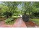 Beautiful front yard with brick path leading to a landscaped lawn at 5513 Doemont Dr, Apex, NC 27539
