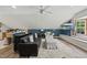 Stylish living area featuring a modern bar, comfortable seating, and a convenient kitchenette for easy entertaining at 5513 Doemont Dr, Apex, NC 27539