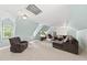 Spacious living room with plush carpeting, comfortable seating, and a mounted television at 5513 Doemont Dr, Apex, NC 27539