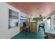 Pool house bar featuring a bamboo facade and coastal decor at 5513 Doemont Dr, Apex, NC 27539