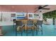 Cozy bar area with seating and a flat screen TV in the pool house at 5513 Doemont Dr, Apex, NC 27539