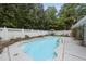 Refreshing backyard swimming pool with elegant landscaping at 5513 Doemont Dr, Apex, NC 27539