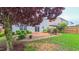 Backyard featuring a patio with seating, barbecue grill and fenced yard with an abundance of greenery at 5535 Spindlewood Ct, Durham, NC 27703