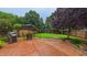 Spacious backyard with a stamped concrete patio, grill and seating, ideal for outdoor entertaining at 5535 Spindlewood Ct, Durham, NC 27703