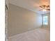Bedroom showcasing neutral walls, carpet floors, and natural lighting at 5535 Spindlewood Ct, Durham, NC 27703