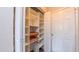 Spacious closet with custom shelving and ample storage for organizing clothes and accessories at 5535 Spindlewood Ct, Durham, NC 27703