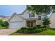 Charming home featuring well-manicured lawn, stone accents and a two-car garage at 5535 Spindlewood Ct, Durham, NC 27703
