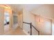 Second floor hallway with carpet and staircase at 5535 Spindlewood Ct, Durham, NC 27703