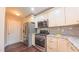 Updated kitchen featuring stainless steel appliances, granite countertops, and stylish backsplash at 5535 Spindlewood Ct, Durham, NC 27703