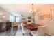 Inviting living room featuring a fireplace, chandelier, and a beautiful area rug at 5535 Spindlewood Ct, Durham, NC 27703