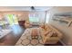 Cozy living room area featuring a ceiling fan and an exit to the exterior at 5535 Spindlewood Ct, Durham, NC 27703