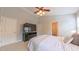 Spacious main bedroom featuring neutral walls, a ceiling fan, and an ensuite bathroom at 5535 Spindlewood Ct, Durham, NC 27703