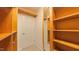Well-organized walk-in closet with shelving and a mirrored door at 5535 Spindlewood Ct, Durham, NC 27703