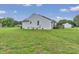 Well-maintained backyard with a deck and exterior view of the light blue single-Gathering home at 5849 Rocking Chair Dr, Youngsville, NC 27596