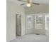 Bright bedroom with a bay window, ceiling fan, and an attached closet at 5849 Rocking Chair Dr, Youngsville, NC 27596