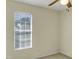 Neutral bedroom with window allowing natural light to stream in, and a ceiling fan at 5849 Rocking Chair Dr, Youngsville, NC 27596