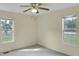 Bedroom with a ceiling fan and two large windows at 5849 Rocking Chair Dr, Youngsville, NC 27596