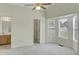 Spacious bedroom with ceiling fan, bay window, and an ensuite bathroom at 5849 Rocking Chair Dr, Youngsville, NC 27596
