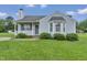 Charming home with a well-maintained lawn, inviting porch, and a classic bay window at 5849 Rocking Chair Dr, Youngsville, NC 27596