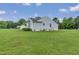 Single Gathering home with light blue siding, well maintained lawn, and mature landscaping at 5849 Rocking Chair Dr, Youngsville, NC 27596