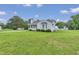 Inviting home with a large, grassy front yard, perfect for outdoor activities and curb appeal at 5849 Rocking Chair Dr, Youngsville, NC 27596