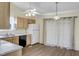 Functional kitchen with wood cabinets, laminate countertops, and a dining area with sliding glass doors at 5849 Rocking Chair Dr, Youngsville, NC 27596
