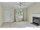 Comfortable living room with a fireplace, ample natural light, and a welcoming doorway at 5849 Rocking Chair Dr, Youngsville, NC 27596