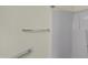 Shower space with a white shower surround and safety bar at 5849 Rocking Chair Dr, Youngsville, NC 27596