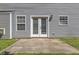 Backyard featuring a concrete patio and gray vinyl siding at 5940 Brambleton Ave, Raleigh, NC 27610