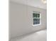 Bright bedroom with neutral carpeting and a large window at 5940 Brambleton Ave, Raleigh, NC 27610