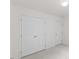 Neutral bedroom with carpet and white doors at 5940 Brambleton Ave, Raleigh, NC 27610