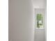 Hallway with natural light through the window at 5940 Brambleton Ave, Raleigh, NC 27610