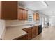 Kitchen with stainless steel appliances and sink, opening to the living room with a fireplace at 5940 Brambleton Ave, Raleigh, NC 27610