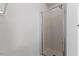 Bathroom featuring a modern shower with sleek glass door and updated fixtures at 5940 Brambleton Ave, Raleigh, NC 27610