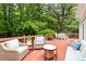 Wooden back deck with comfortable seating and lush backyard view at 601 Culpepper Ct, Durham, NC 27712