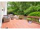Wooden back deck with comfortable seating and grill, perfect for outdoor entertaining at 601 Culpepper Ct, Durham, NC 27712
