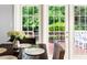 Dining area with large glass doors that allow for views of and access to the outdoor deck at 601 Culpepper Ct, Durham, NC 27712