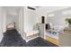 Hallway featuring black tile floor, storage bench, and decor at 601 Culpepper Ct, Durham, NC 27712
