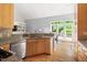 Kitchen with granite countertops, stainless steel appliances and views to the outdoor dining area at 601 Culpepper Ct, Durham, NC 27712
