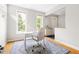 Bright home office with large windows, hardwood floors, and a work desk at 601 Culpepper Ct, Durham, NC 27712