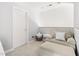 Cozy sitting room with chair, ottoman and side table at 601 Culpepper Ct, Durham, NC 27712