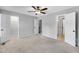 Neutral primary bedroom boasting multiple closets, a ceiling fan and an ensuite bathroom at 6513 Hearthstone Dr, Raleigh, NC 27615