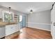 Dining area with sliding door to outdoor deck and decorative light fixture at 6513 Hearthstone Dr, Raleigh, NC 27615