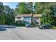 Townhome exterior with manicured landscaping and convenient parking for residents and guests at 6513 Hearthstone Dr, Raleigh, NC 27615