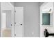 Hallway with doorways to bedrooms and hall closet, and hardwood flooring at 6513 Hearthstone Dr, Raleigh, NC 27615