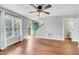 Spacious living room with ample natural light, hardwood floors, and easy access to outdoors at 6513 Hearthstone Dr, Raleigh, NC 27615