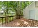 Private wooden deck surrounded by lush trees offers a serene outdoor living space at 7315 Sandy Creek Dr # 7, Raleigh, NC 27615